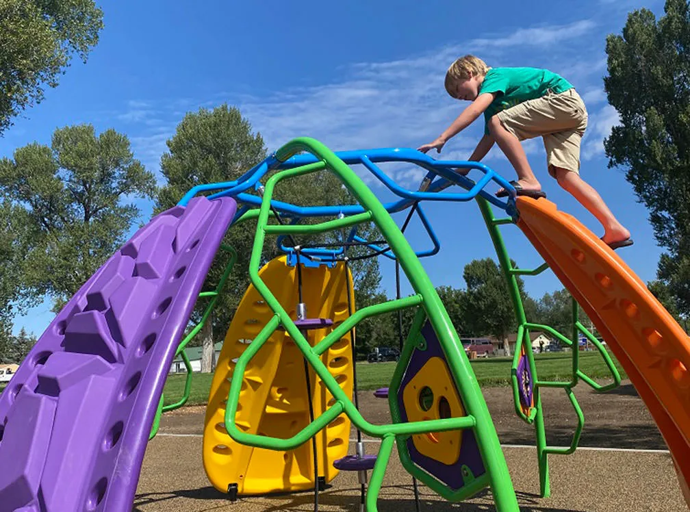 Dome plastic and metal climbing structure at Craig City Park